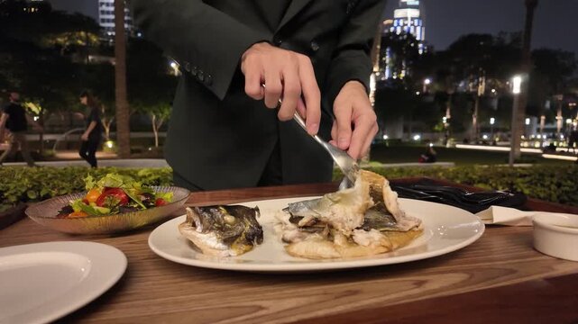 Luxury Dining in Dubai Tableside Fish Filleting Service at a High-End Restaurant Overlooking the Iconic Burj Khalifa and City Lights