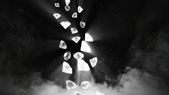 Falling diamonds and green emerald gemstones in ethereal mist and dramatic lighting on black background