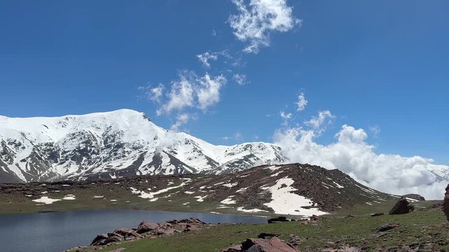 mountain landscape with snow and clouds
