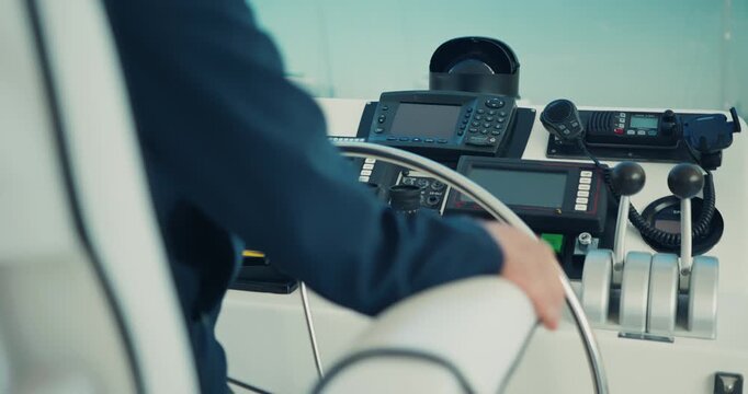 Captain Steering Boat in Modern Control Room