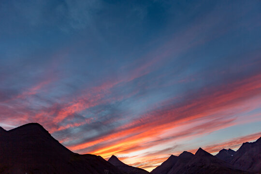 A solitary moment through the landscape somewhere in Diamond Beach, Iceland as sunset spills across the sky