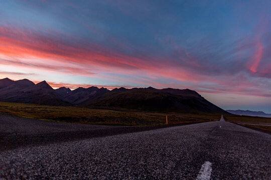 Rugged mountains leads toward distant peaks across Diamond Beach, Iceland