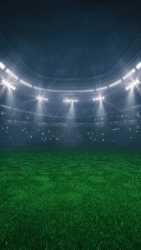 Green grass field at a sports stadium with glowing spotlights and fans ready for the upcoming night sporting event.