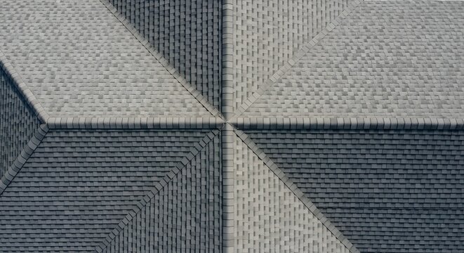 Aerial View of a Textured Roof with Geometric Shadows and Patterns