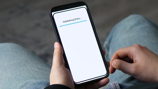 Close-up of a smartphone screen showing data validation in a logistics application. Showcases AI-sorting tech and modern business tools. Ideal for software reviews, digital transformation marketing