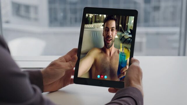 Freelancer talking video call tablet at windowsill closeup. Man chatting tab