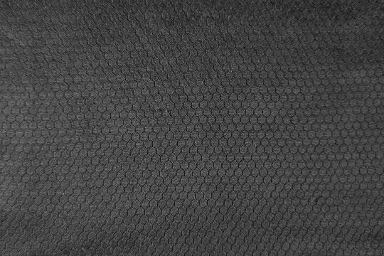 Charcoal gray technical mesh fabric with tiny hexagonal breathable holes