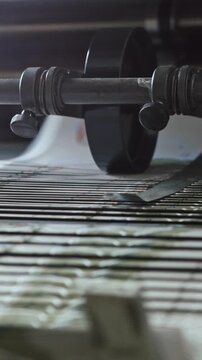 Printing Process on polygraph industry - brochures moving on the conveyor belt