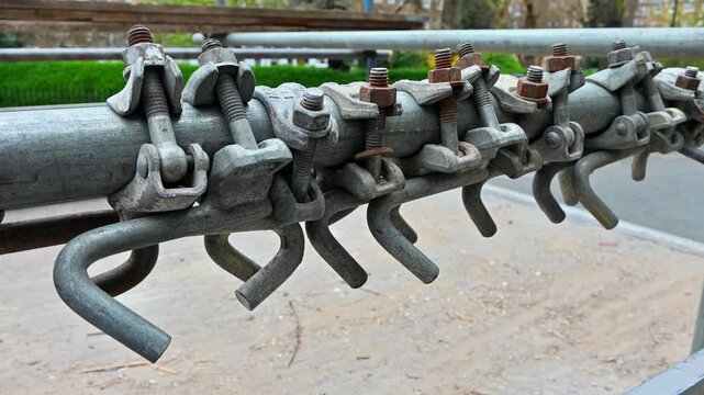 London, UK, April 3rd 2026:Close-up of scaffolding clamps and couplers. Scaffold parts put in storage on a contractors lorry. Concept for building and construction. Static shot, 4K.