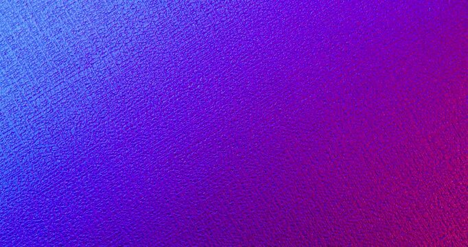 Seamless Blue Purple Textured Surface. Video of rough material with vibrant blue to purple gradient and subtle light movement in true seamless loop.
