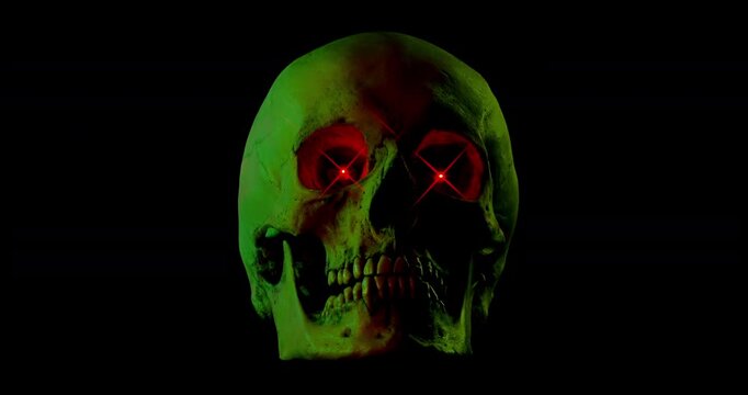 Neon Skull with Glowing Eyes. Video of motionless human skull with bright red glowing X eyes and shifting colorful neon lights on black background.