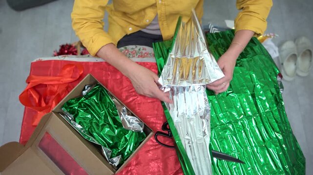 Preparing colorful gift wrap for special occasions in a cozy setting during the holiday season