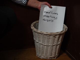 Employee putting work demands in the bin