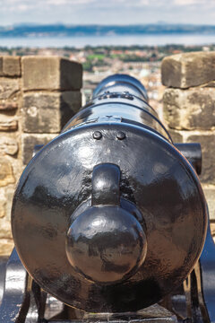 Historic defensive cannon on castle fortification
