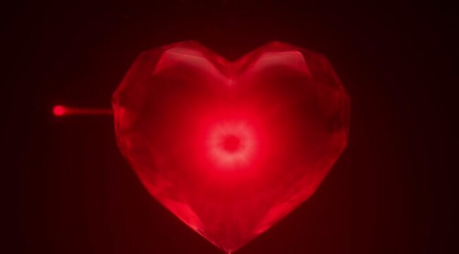A romantic red heart symbol with 3d shape and glossy passion