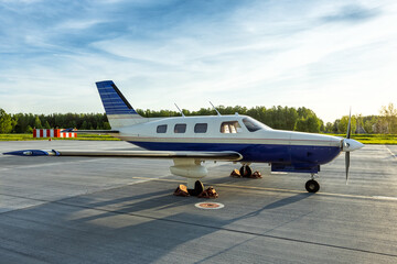 Fototapeta premium Private turboprop aircraft at the airport in the evening