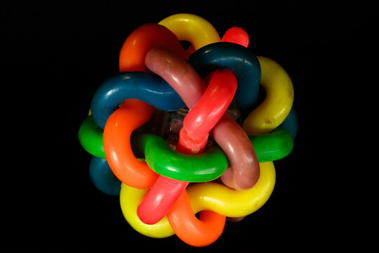 Item is a colorful, knotted pet chew toy,featuring an internal bell to engage pets during play. Colorful Bells Woven Ball Tpr Dog Toy Sounding Bite-resistant Chew Rainbow Balls with Bell
