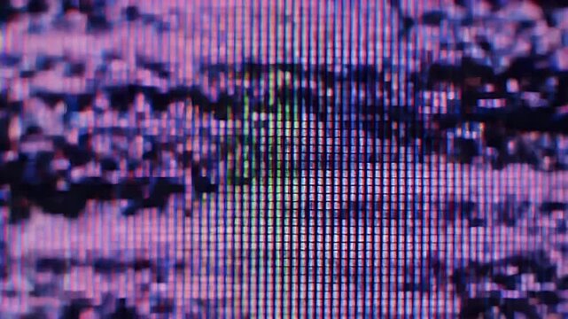A distorted TV screen displays a broken signal with purple hues and black spots.