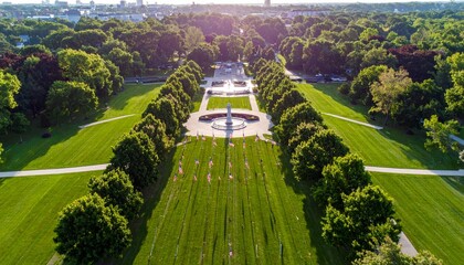 Obraz premium Aerial view of a manicured park with symmetrical landscaping and pathways.