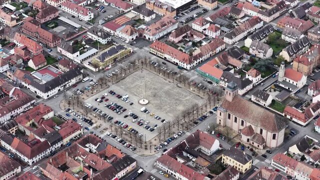 Aerial view of the Place d'Armes, a large square surrounded by buildings with red roofs, Neuf-Brisach, Grand Est, France.