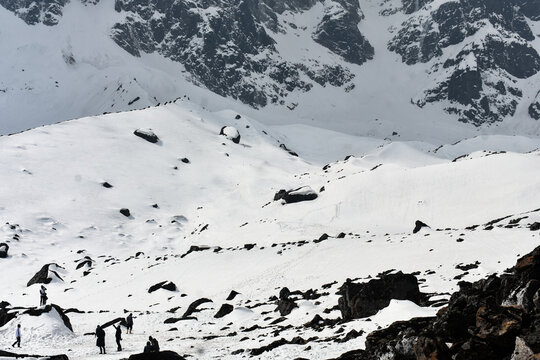 Snow-covered Himalayan valley with rugged peaks, clouds, at Kala Patthar, North Sikkim, India.