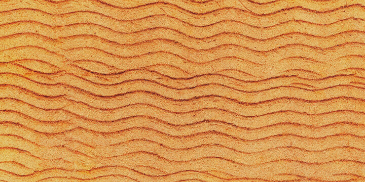 A close-up view of a textured orange surface with wavy patterns