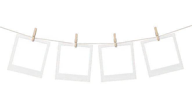 Vintage instant photo frames hanging on clothesline with wooden pegs, blank polaroid style film set, nostalgic photography gallery mockup isolated on Transparent Background