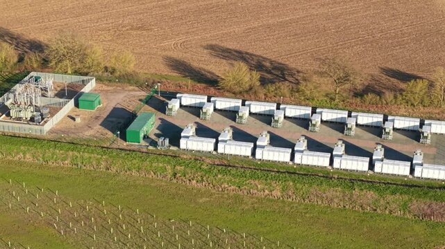 Aerial view of National Grid Bramford 400kV Substation and Battery energy storage amidst fields, Ipswich, England, United Kingdom.