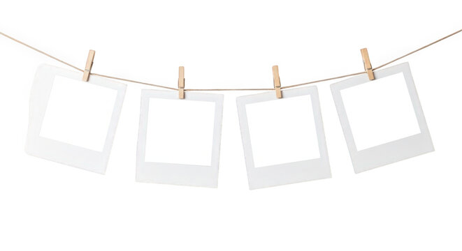 Four empty photo frames on a string isolated on transparent background isolated on transparent background