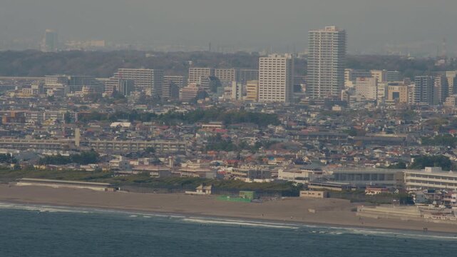 Enoshima shoreline with soft waves and peaceful seaside mood