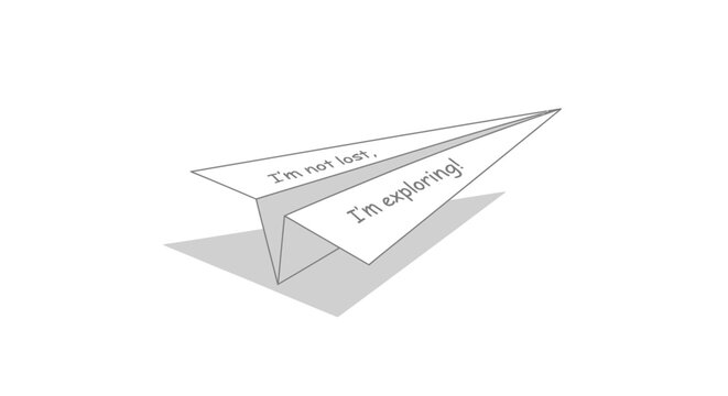 Paper airplane in mid flight.