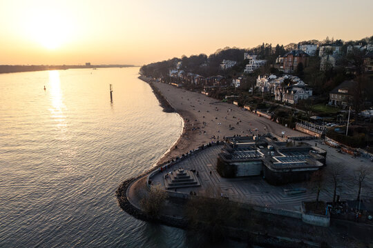 Aerial drone photo of the beach at the Elbe River in &Ouml;velg&ouml;nne in Hamburg at sunset