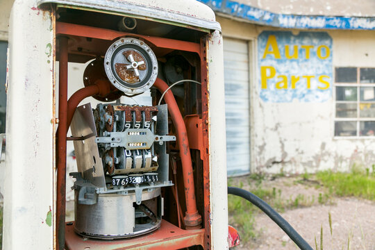 Vintage gas pump interior with exposed mechanics and Route 66 auto shop
