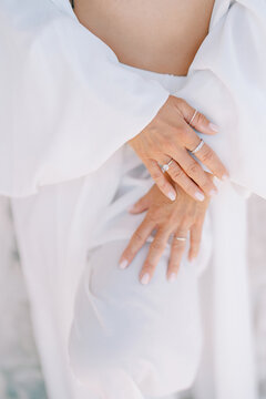 Serene Expecting Mother Holds Belly Softly In Tranquil Light