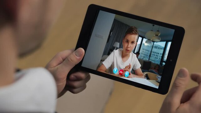 Man hands holding tab listening boy video call at room closeup. Father son talk