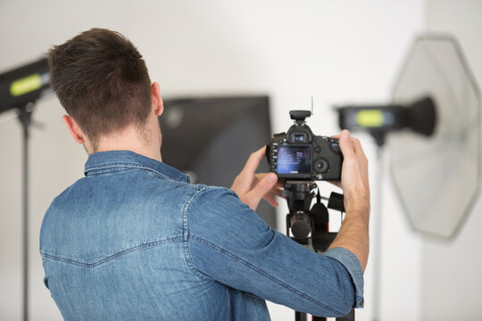 man making video blog about photography