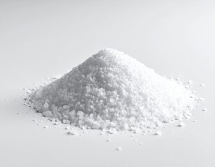 Fototapeta premium Fine White Salt Pile on White Background for Culinary Use