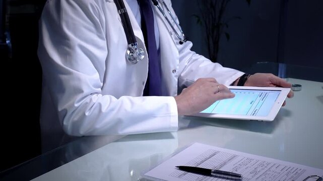 Medical doctor analyzing digital health records on a tablet computer, ensuring patient data management and secure care information in a modern clinic setting