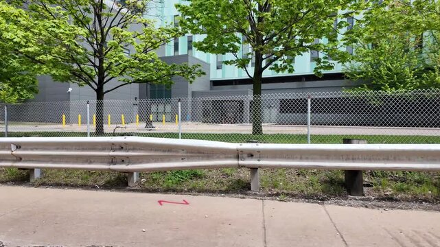 Driving Through Downtown Detroit With Sidewalks and Graffiti