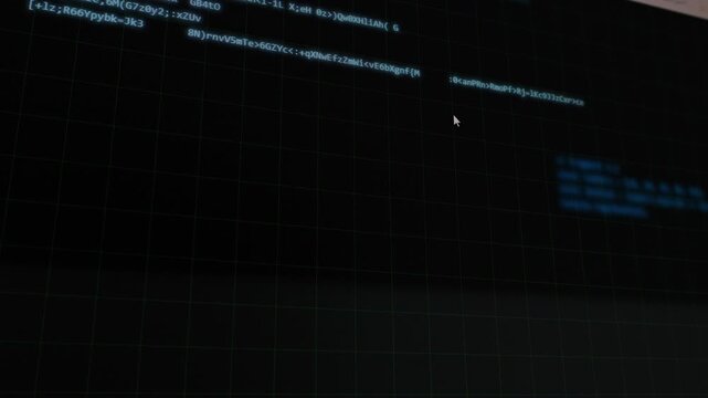 Display of coding process and program development on screen in a dimly lit room with focus on various coding languages and techniques