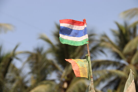 Banjul, Gambia. 27-02-2026. A small flag in Gambian colours on the bow a fishing boat.