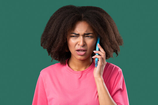 Annoyed Young African Woman Quarreling Talking On Mobile Phone. Angry Lady