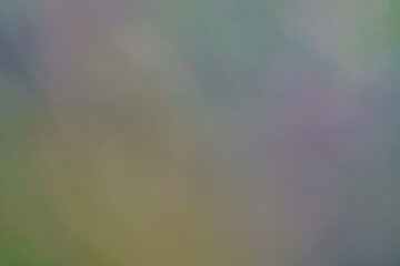 Abstrakcyjne tło z miękkim przejściem kolorów w pastelowych odcieniach zieleni, szarości i fioletu. Rozmyta tekstura typu bokeh, idealna do projektów graficznych, prezentacji i jako tło. © Henryk Niestrój