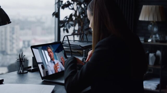 Unknown businesswoman talking laptop screen at modern corporate office close up.