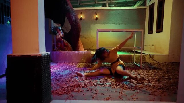 Woman's Intense Contemporary Dance on a Leaf-Covered Floor
