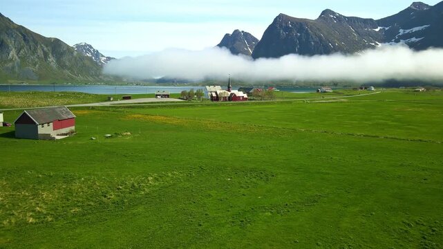 Aerial footage of Flakstad in Lofoten, Norway, during a sunny day