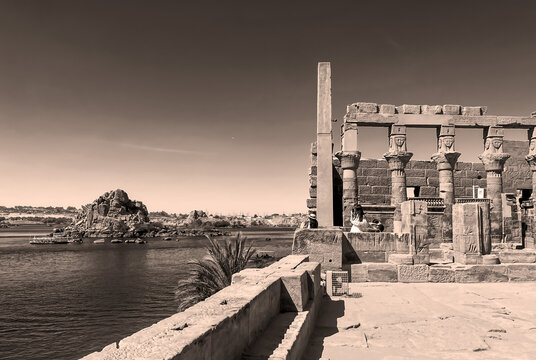 Women looking at the nile from Philae Temple in Aswan Egypt. Black and white