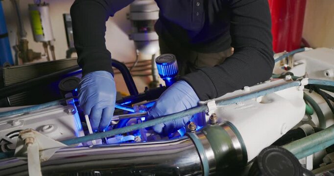 Technician Working on Engine in Industrial Setting