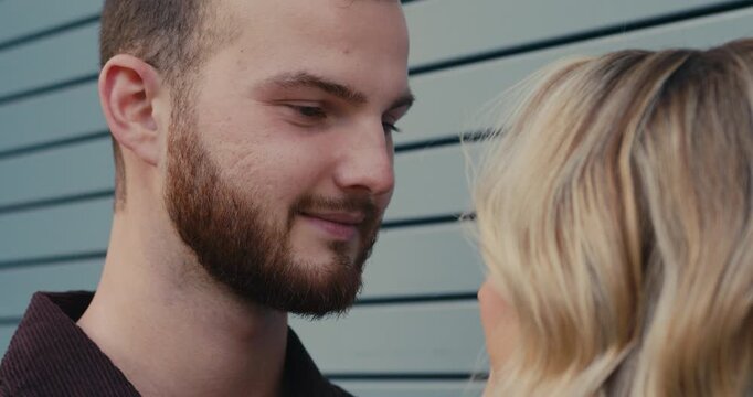 Close-up shot of a loving couple, a romantic and tender gaze into each other eyes. Mutual feelings.