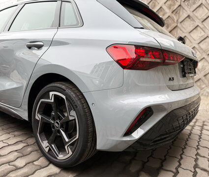 A nardo gray 
Audi A3 Sportback 35 TFSI IV (8Y) parked on street, luxury car exterior. The modern exterior of a premium Germany sportback hatchback car Audi A3 gray color. VAG Group. 